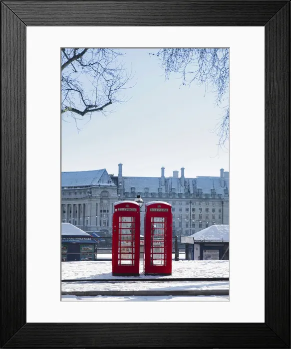 Framed Print : United Kingdom, England, London, red phone boxes on Victoria Embankment in the snow Framed Print : United Kingdom, England, London, red phone boxes on Victoria Embankment in the snow