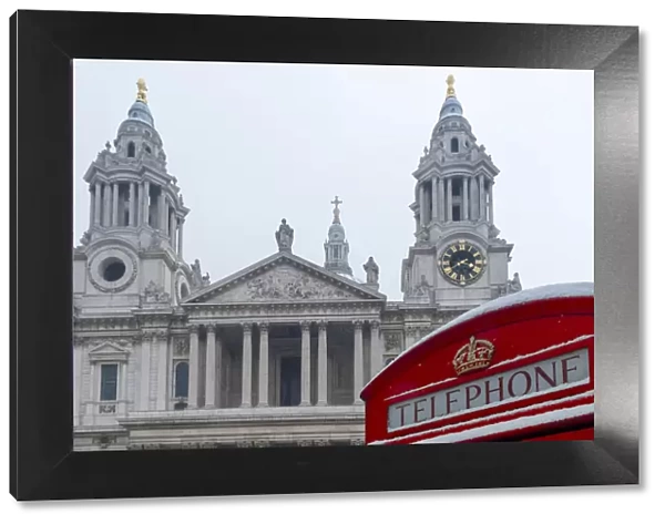 United Kingdom, England, London, a red London phone box in front of St Pauls cathedral