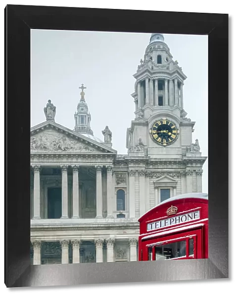 United Kingdom, England, London, a red London phone box in front of St Pauls cathedral