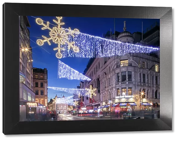 Night view of Christmas lights at Piccadilly Circus in front of Regent Street, London