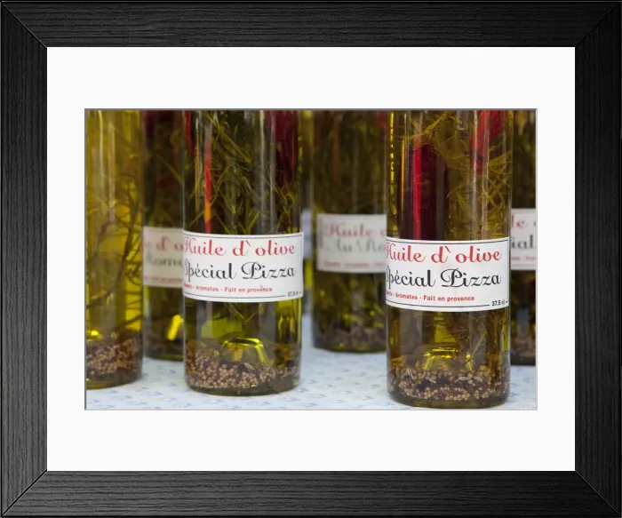 Framed Print : Olive oils for sale in the market in St Remy France Framed Print : Olive oils for sale in the market in St Remy France
