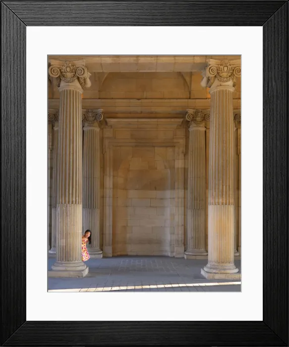 Framed Print : France, Paris, The Louvre, girl aged 8 hiding behind pillar (MR)