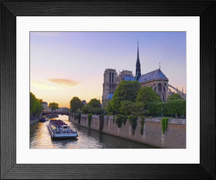 Framed Print : France, Paris, Notre Dame Cathedral, Torboat on River Seine at dusk Framed Print : France, Paris, Notre Dame Cathedral, Torboat on River Seine at dusk