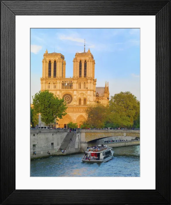 Framed Print : France, Paris, Notre Dame Cathedral and tourist boat on River Seine at sunset Framed Print : France, Paris, Notre Dame Cathedral and tourist boat on River Seine at sunset