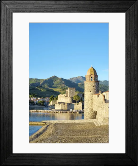Framed Print : Clocktower of Notre-Dame-des-Anges church and the Chateau Royal de Collioure Framed Print : Clocktower of Notre-Dame-des-Anges church and the Chateau Royal de Collioure