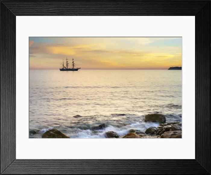 Framed Print : Silhouette of sailing ship at sunset off the coast of Cassis, Bouches-du-Rhone Framed Print : Silhouette of sailing ship at sunset off the coast of Cassis, Bouches-du-Rhone