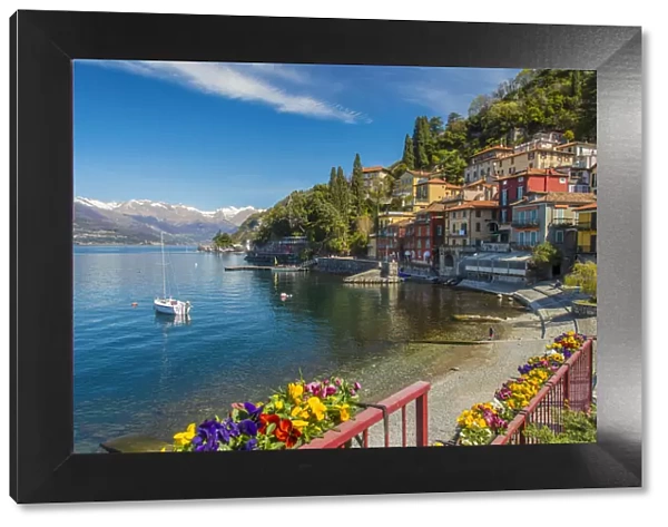 Scenic springtime view of Varenna with snowy Alps in the background, Lake Como, Lombardy