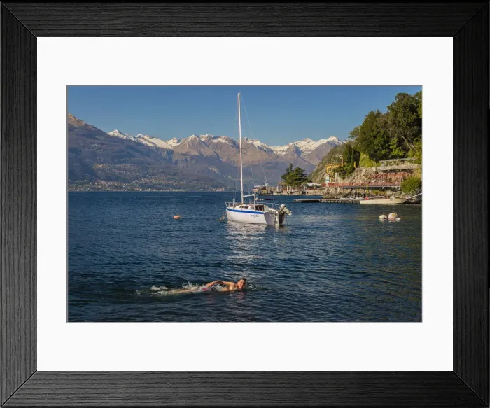 Framed Print : Young kid swimming into Lake Como, Varenna, Lombardy, Italy Framed Print : Young kid swimming into Lake Como, Varenna, Lombardy, Italy