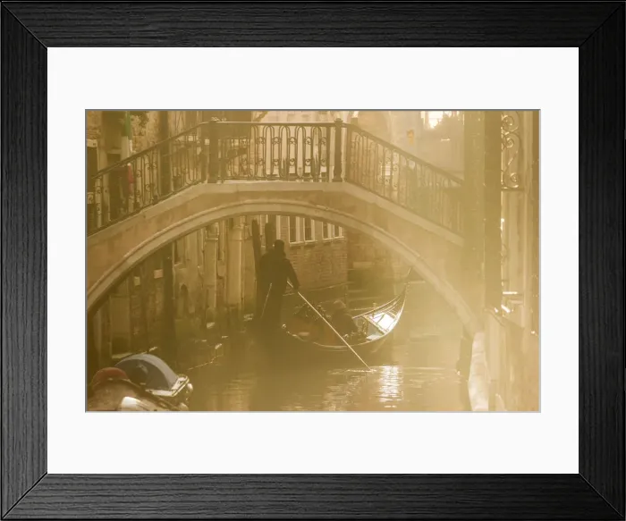 Framed Print : Venice, Veneto, Italy. Gondolier on a Gondola passing under a bridge, backlight view Framed Print : Venice, Veneto, Italy. Gondolier on a Gondola passing under a bridge, backlight view
