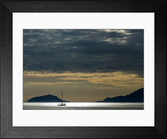 Framed Print : Europe, Italy, Island of Palmaria from La Spezia, a yacht travels though the Gulf Framed Print : Europe, Italy, Island of Palmaria from La Spezia, a yacht travels though the Gulf