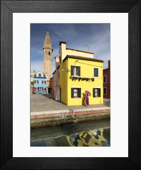 Framed Print : Woman in pink costume posing in front of yellow house during Carnival, Island of Burano Framed Print : Woman in pink costume posing in front of yellow house during Carnival, Island of Burano