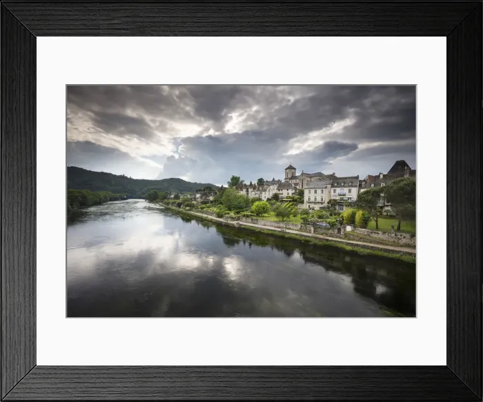 Framed Print : France, Correze, Argentat, The old town and riverbank reflected in the Dordogne river