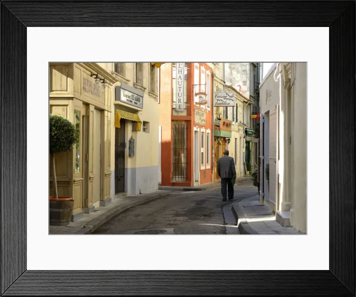 Framed Print : Man walking in one of the many streets in Arles, Provence Alpes Cote d Azur, France Framed Print : Man walking in one of the many streets in Arles, Provence Alpes Cote d Azur, France