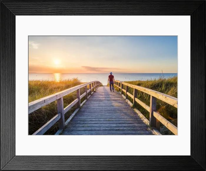 Framed Print : Man walking on a footbridge to Weissenhaauser Strand, Ostholstein, Schleswig-Holstein Framed Print : Man walking on a footbridge to Weissenhaauser Strand, Ostholstein, Schleswig-Holstein