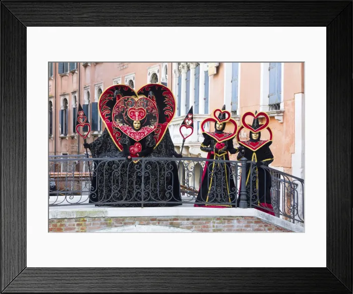 Framed Print : Heart-shaped costumes posing on a bridge at the Venice Carnival, Venice, Italy Framed Print : Heart-shaped costumes posing on a bridge at the Venice Carnival, Venice, Italy