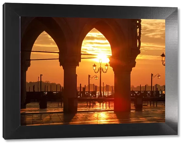 Sunrise through the Arches of Doges Palace in Piazzetta San Marco, Venice, Veneto