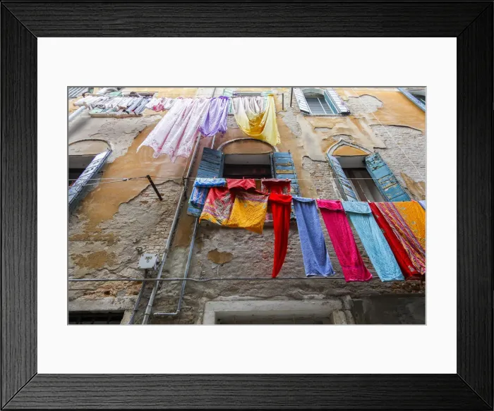 Framed Print : Multicolored laundry hangs in front of an old facade, Venice, Veneto, Italy Framed Print : Multicolored laundry hangs in front of an old facade, Venice, Veneto, Italy