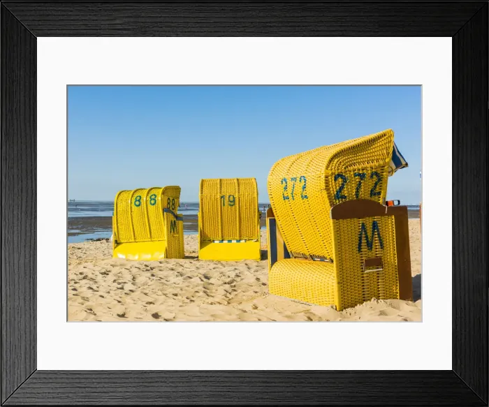 Framed Print : Duhnen, Cuxhaven, Lower Saxony, Germany. Yellow Strandkorbs along the Wadden Sea Framed Print : Duhnen, Cuxhaven, Lower Saxony, Germany. Yellow Strandkorbs along the Wadden Sea