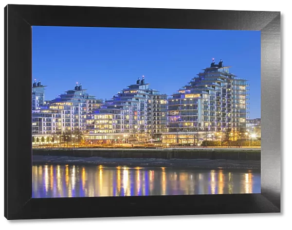 UK, London, A view of Battersea Reach developement from Wandsworth Bridge at dusk