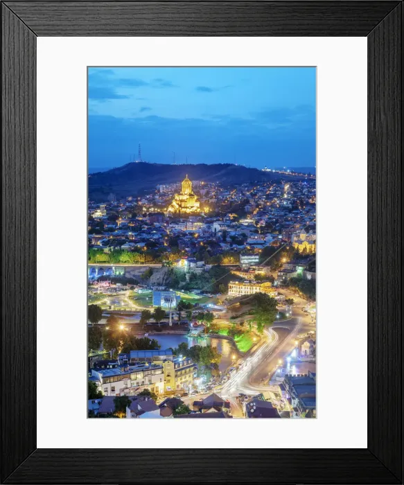 Framed Print : Tbilisi and the Mtkvari river at dusk. On the top the Holy Trinity Cathedral (Tsminda Framed Print : Tbilisi and the Mtkvari river at dusk. On the top the Holy Trinity Cathedral (Tsminda