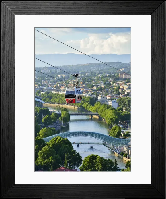 Framed Print : Bridge of Peace and the Mtkvari river. The famous Cable Car above. Tbilisi, Georgia Framed Print : Bridge of Peace and the Mtkvari river. The famous Cable Car above. Tbilisi, Georgia