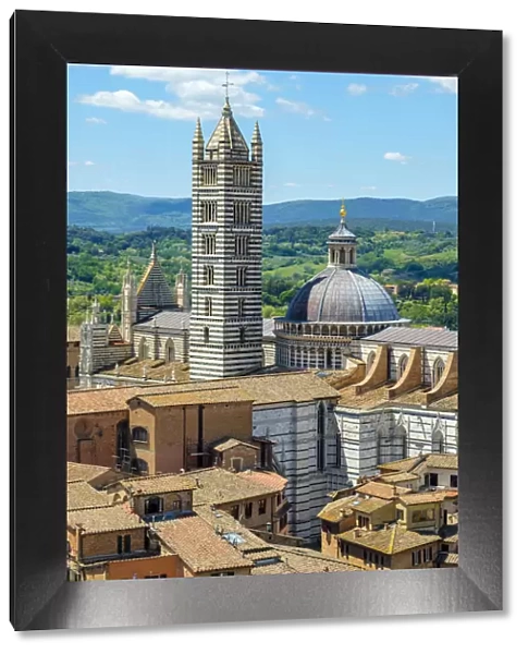 High angle view of Duomo di Siena (Siena Cathedral) and buildings in old town