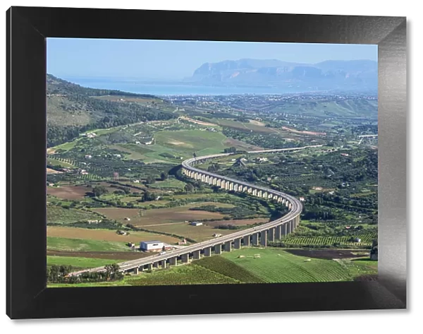 Road withs curve going through mountain landscape, Sicily, Trapani province, Sicily