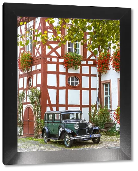 Old classical car in front of traditional building, Rudesheim, Rhine valley, Hesse