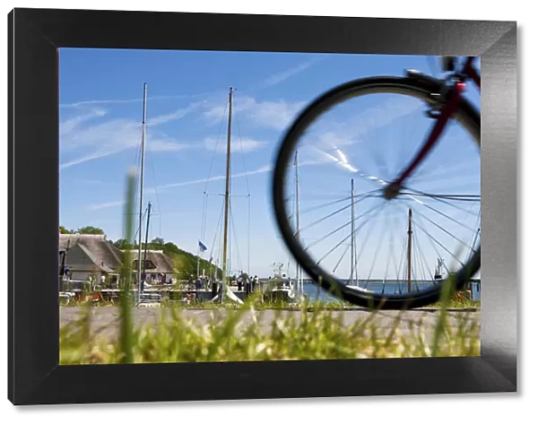 Cyclist in the harbour of Kloster, Hiddensee Island, Mecklenburg-Western Pomerania