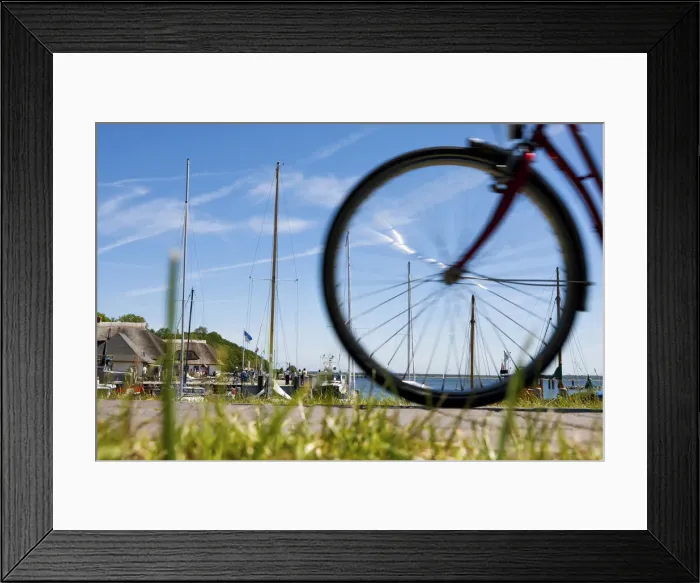 Framed Print : Cyclist in the harbour of Kloster, Hiddensee Island, Mecklenburg-Western Pomerania Framed Print : Cyclist in the harbour of Kloster, Hiddensee Island, Mecklenburg-Western Pomerania