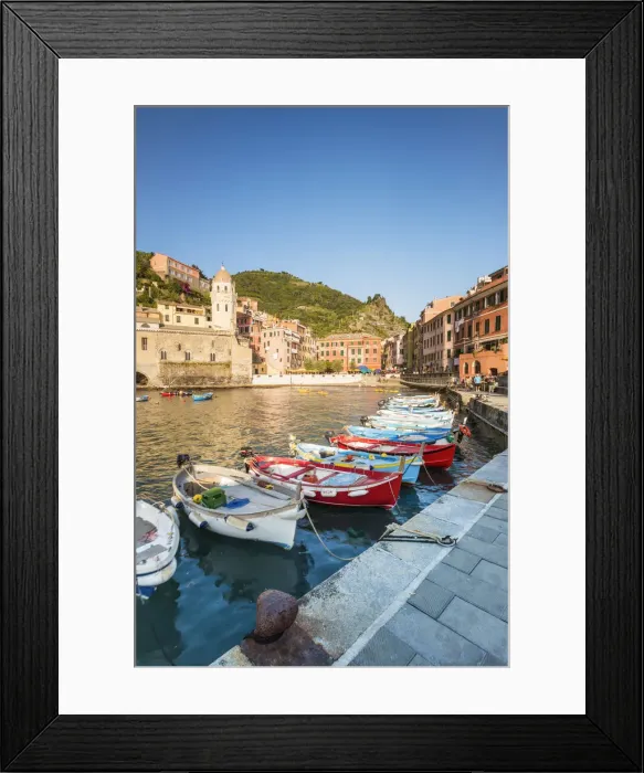 Framed Print : Boats in the colourful port and Santa Margherita di Antiochia church Framed Print : Boats in the colourful port and Santa Margherita di Antiochia church