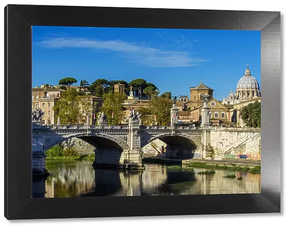 View of Tiber river with St. Peters Basilica in the background, Rome, Italy