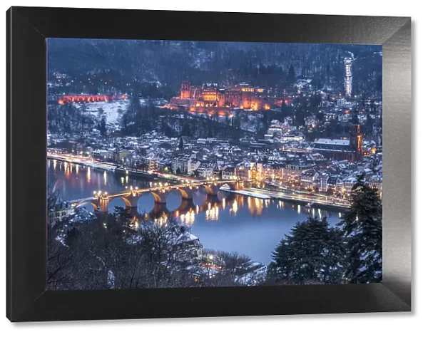 View of the old town of Heidelberg seen from the Philosophers Way in winter at night