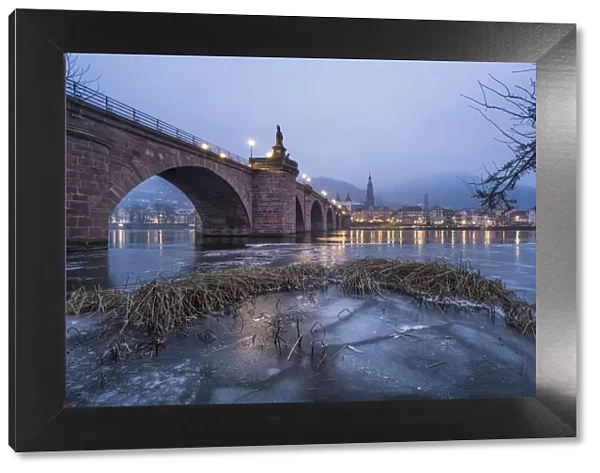 Frozen Neckar river and Old Bridge, Heidelberg, Baden-Wurttemberg, Germany