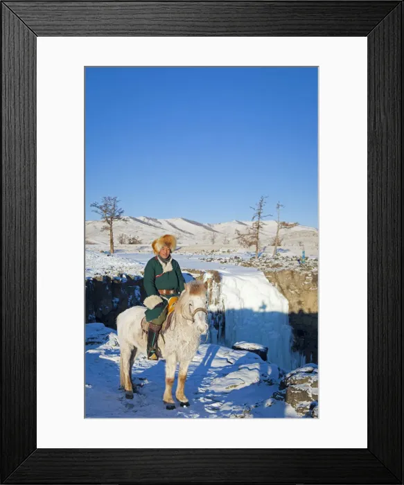 Framed Print : Mongolia, Ovorkhangai, Orkkhon Valley. A man sits on horseback by a frozen waterfall