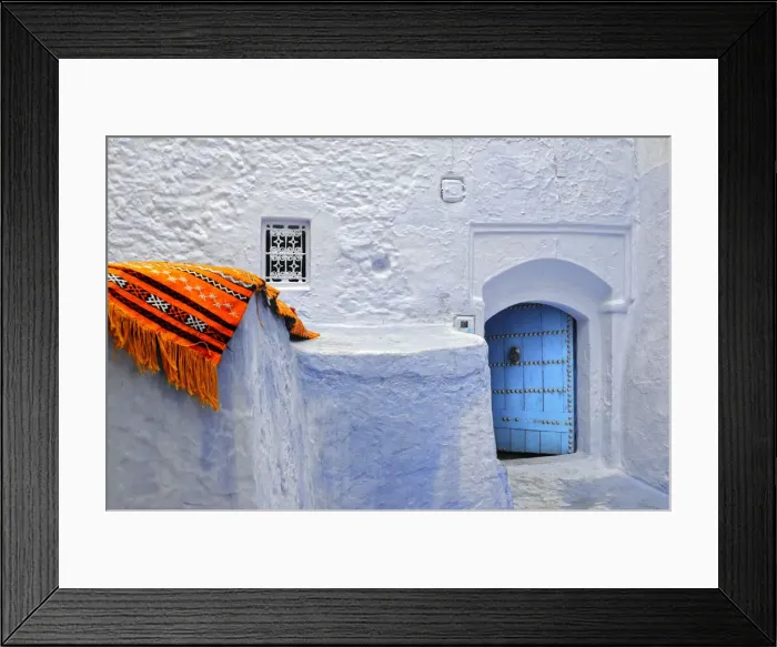 Framed Print : Orange blanket in the bluish Chefchaouen medina. Morocco Framed Print : Orange blanket in the bluish Chefchaouen medina. Morocco