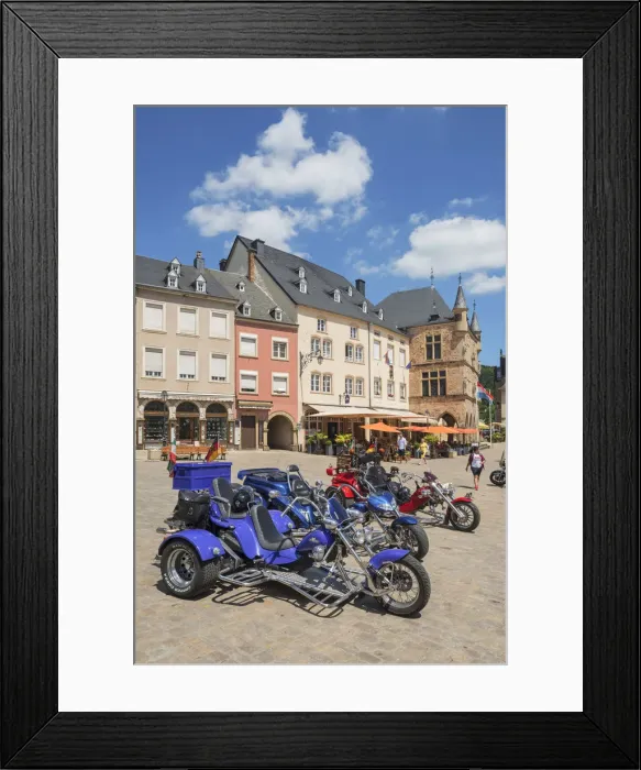 Framed Print : Three-wheeled motorbikes with the historic court house Denzelt at Echternach, Luxembourg Framed Print : Three-wheeled motorbikes with the historic court house Denzelt at Echternach, Luxembourg