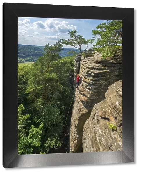 Climbers on rock formations near Berdorf, MAollerthal, Kanton Echternach, Luxembourg