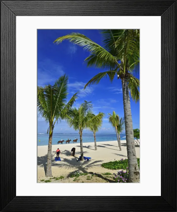 Framed Print : Horse riders on the beach in front of a luxury hotel on the Le Morne Peninsula, Mauritius Framed Print : Horse riders on the beach in front of a luxury hotel on the Le Morne Peninsula, Mauritius