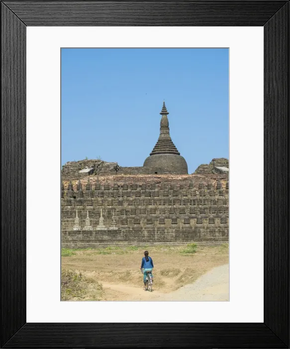 Framed Print : Mrauk-U, Rakhine state, Myanmar. Woman cycling near Koe-Thaung pagoda Framed Print : Mrauk-U, Rakhine state, Myanmar. Woman cycling near Koe-Thaung pagoda