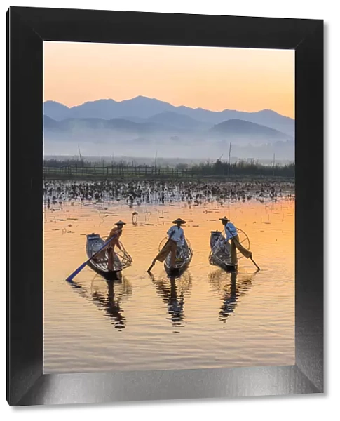 Leg-rowing fishermen of Inle Lake at dawn, Shan State, Myanmar