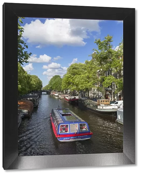 Cruise boat on Prinsengracht canal, Amsterdam, Netherlands