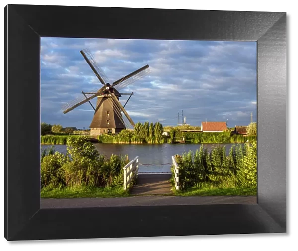 Windmill in Kinderdijk at sunset, UNESCO World Heritage Site, South Holland, The