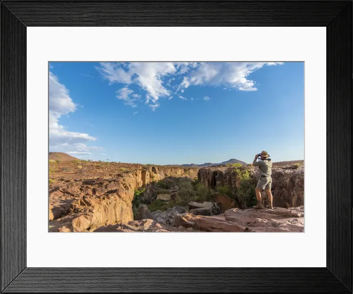 Framed Print : Africa, Namibia, Palmwag. Ranger looking over the Aub Canyon Framed Print : Africa, Namibia, Palmwag. Ranger looking over the Aub Canyon
