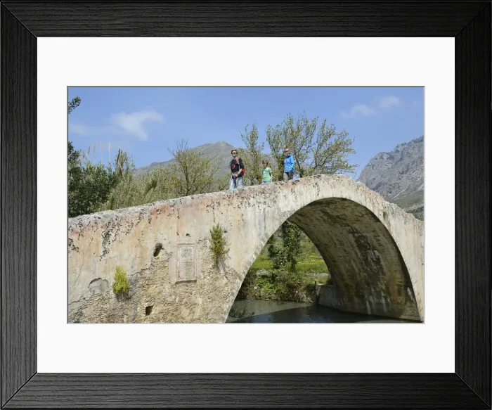 Framed Print : Family moves over the arch bridge over the River Megalopotamos the Preveli, Crete Framed Print : Family moves over the arch bridge over the River Megalopotamos the Preveli, Crete