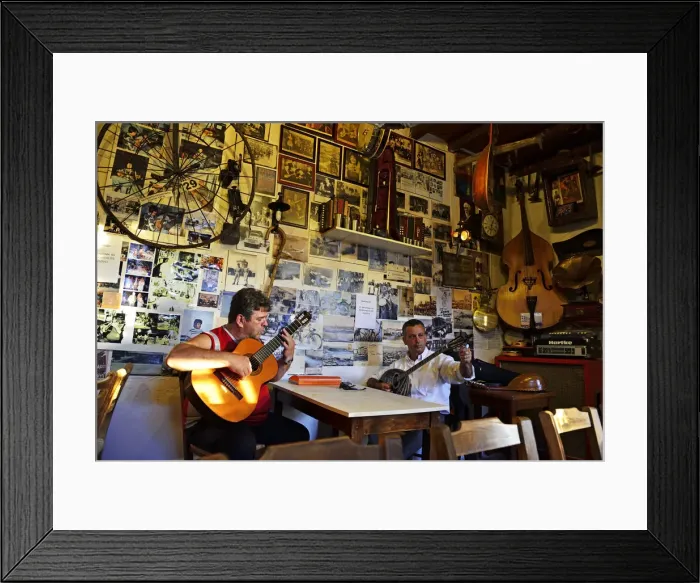 Framed Print : Men play musical instruments at a bar in Crete, Greece, Europe Framed Print : Men play musical instruments at a bar in Crete, Greece, Europe