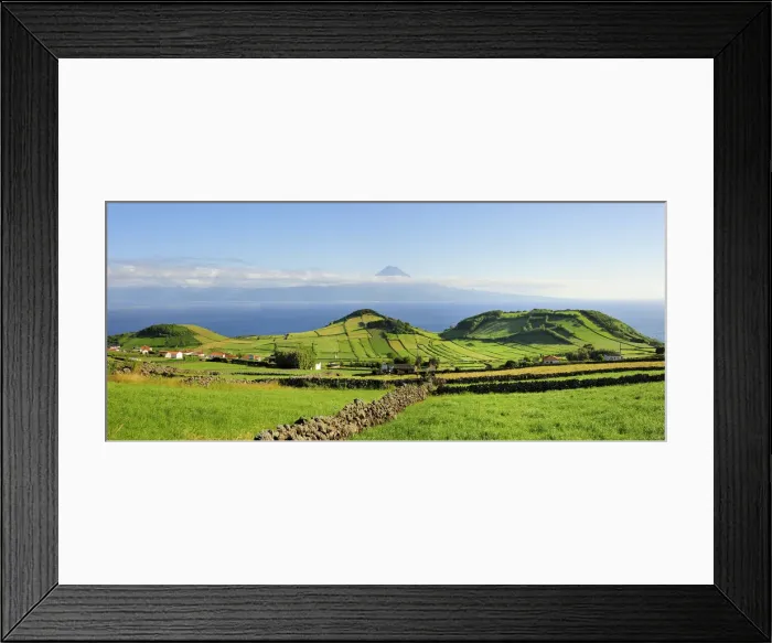 Framed Print : Volcanic craters along the Sao Jorge island and the Pico volcano on the horizon