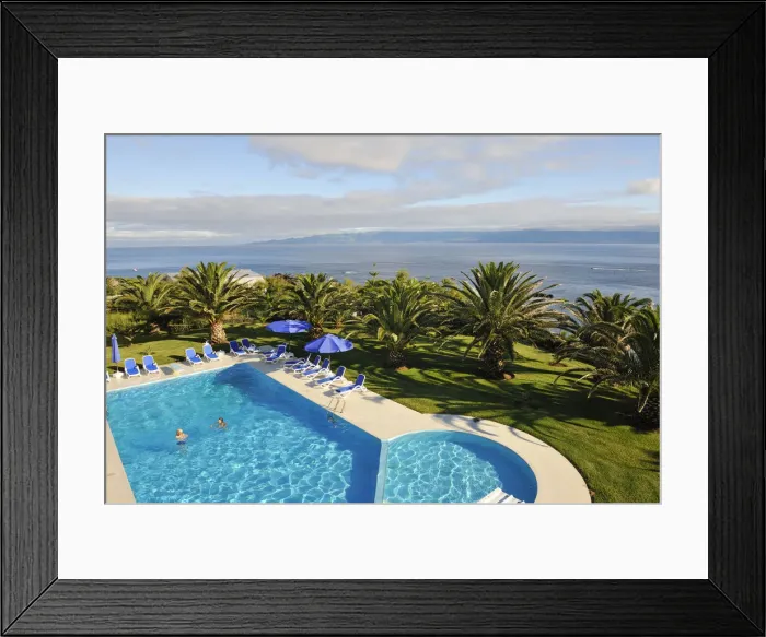 Framed Print : A swimming pool in a hotel of Velas, capital city of Sao Jorge. Azores islands, Portugal Framed Print : A swimming pool in a hotel of Velas, capital city of Sao Jorge. Azores islands, Portugal