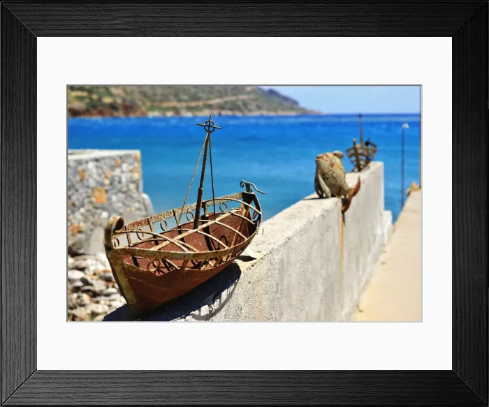 Framed Print : Model of a rusted ship is placed as an ornament on a wall in Plaka, Crete, Greece, Europe Framed Print : Model of a rusted ship is placed as an ornament on a wall in Plaka, Crete, Greece, Europe