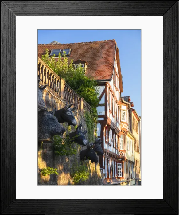 Framed Print : Sculptures of animal heads and half-timbered buildings, Marburg, Hesse, Germany Framed Print : Sculptures of animal heads and half-timbered buildings, Marburg, Hesse, Germany